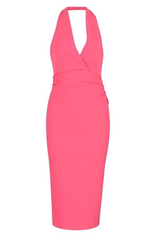 Woman wearing a figure flattering  London Bandage Dress - Hot Pink BODYCON COLLECTION